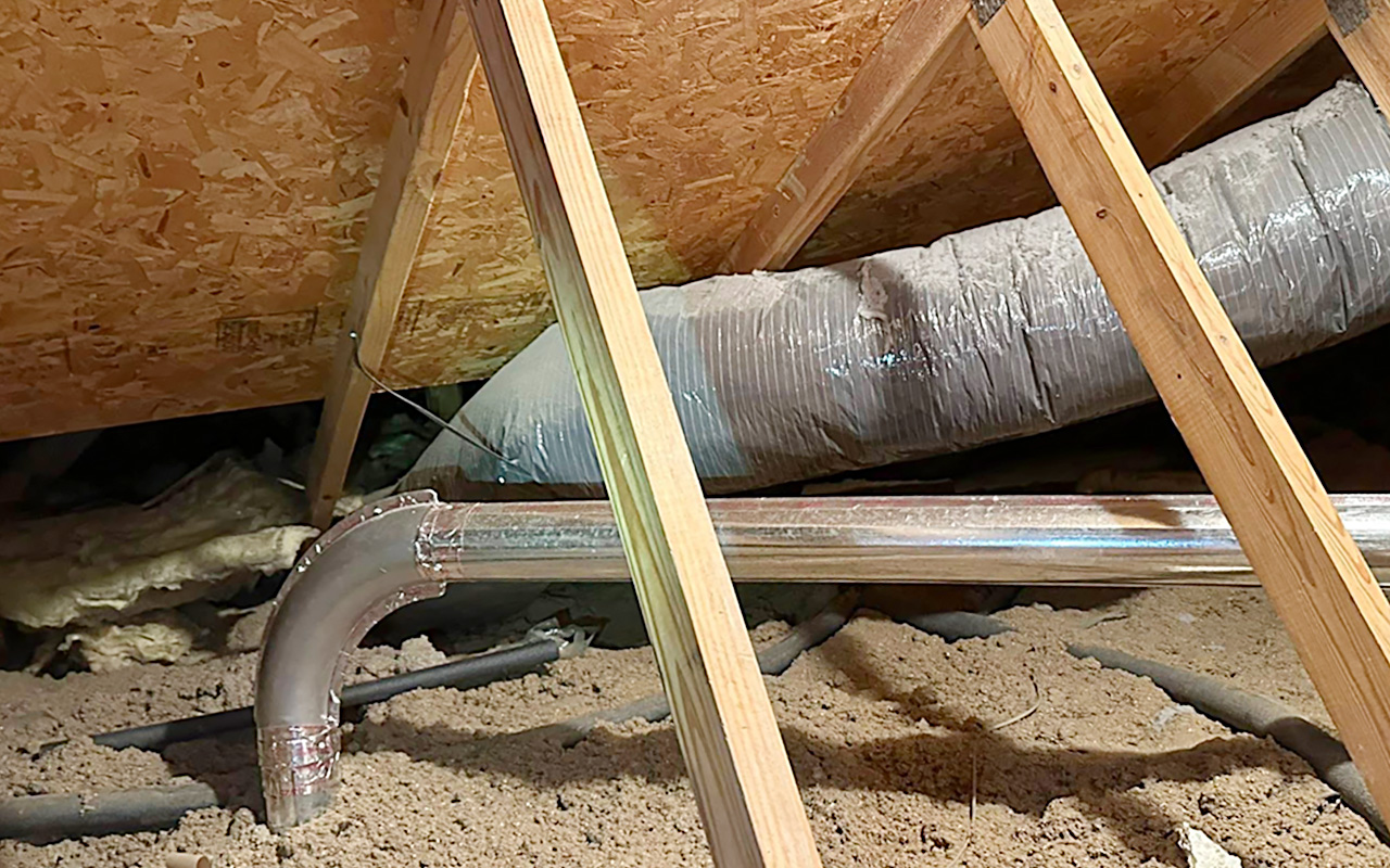Dryer-Ell Installed in the Attic Venting Through the Roof